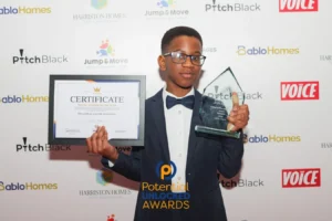 Jayce Joyce receiving the Potential Unlocked Young Author of the Year award