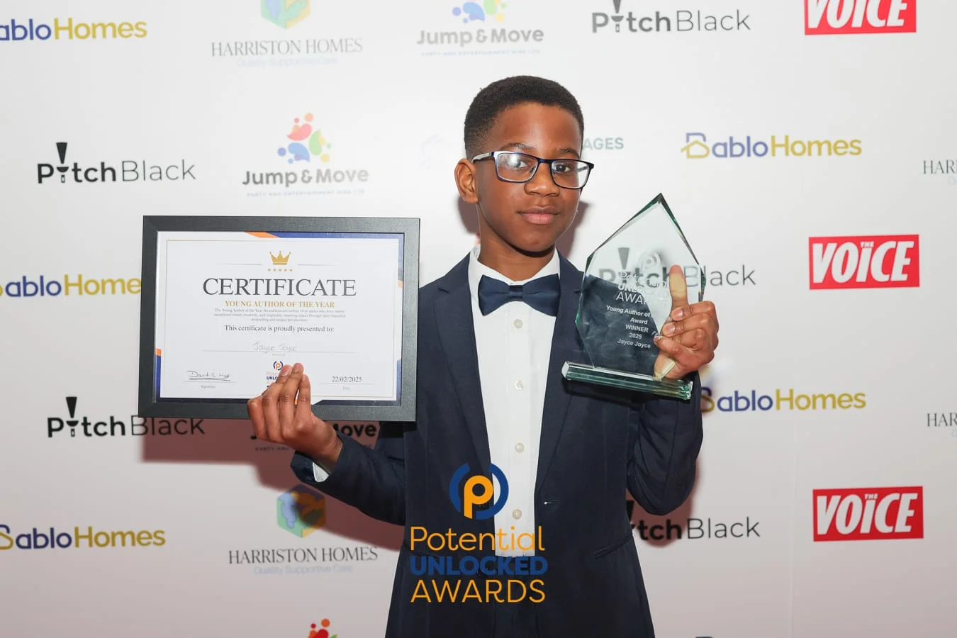 Jayce Joyce receiving the Potential Unlocked Young Author of the Year award