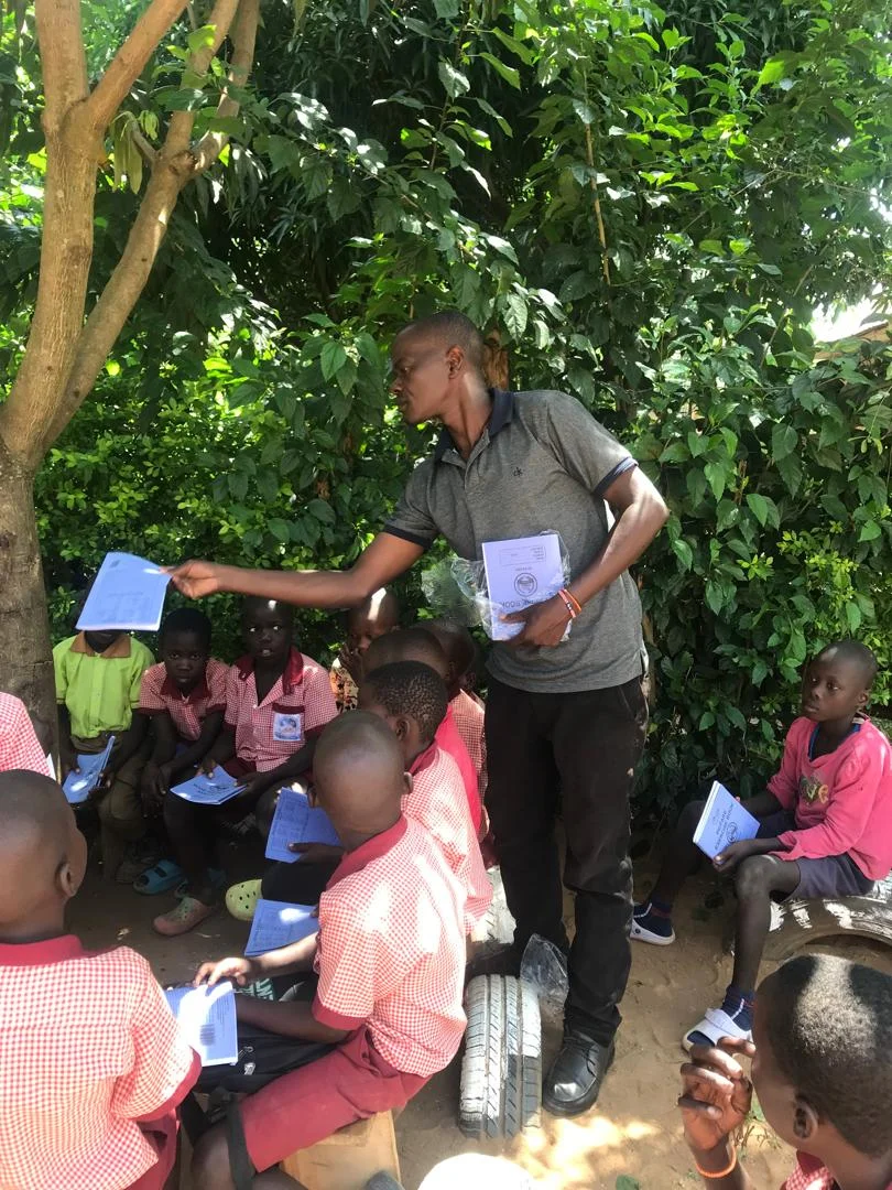 Ugandan children receiving educational support from Jayce's World