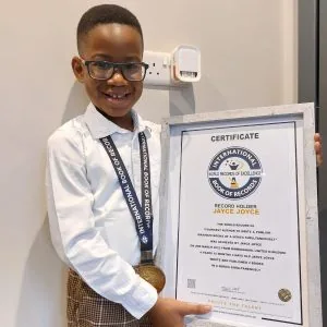 Jayce Joyce with his International Book of World Records certificate — auto-generated thumbnail variant