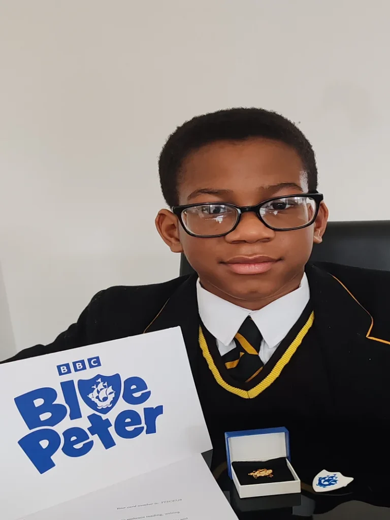 Jayce Joyce BCyA holding his BBC Blue Peter Gold Badge — December 2025
