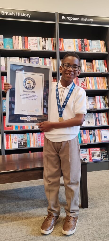 Jayce Joyce BCyA holding his Guinness World Records certificate for Youngest Editor of a Published Anthology